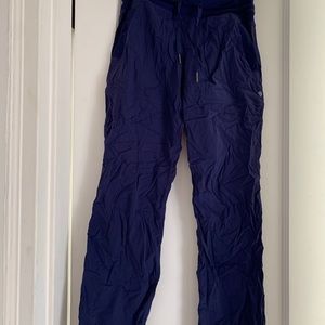 Variety of different lululemon pants and workout leggings.